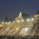 Crowds gather on the illuminated ghats of Varanasi on Dev Deepawali night