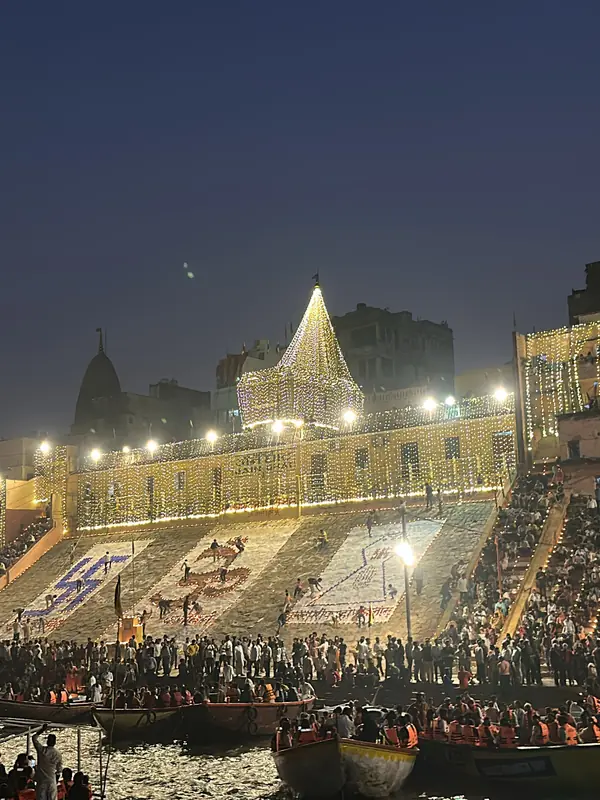 Crowds gather on the illuminated ghats of Varanasi on Dev Deepawali night