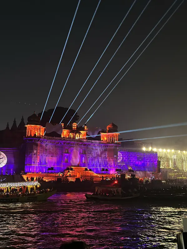 Purple lights and laser beams over a ghat in Varanasi during Dev Deepawali