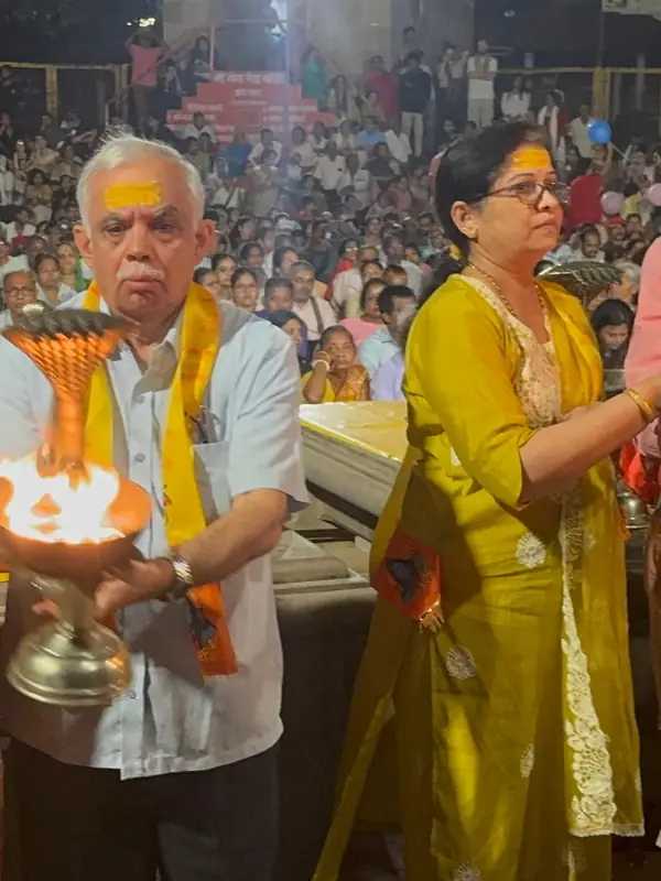 House of Ullassa guests holding aarti lamps during the evening Ganga Aarti in Varanasi