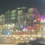 Illuminated ghats of Varanasi at night seen from a boat on the Ganga