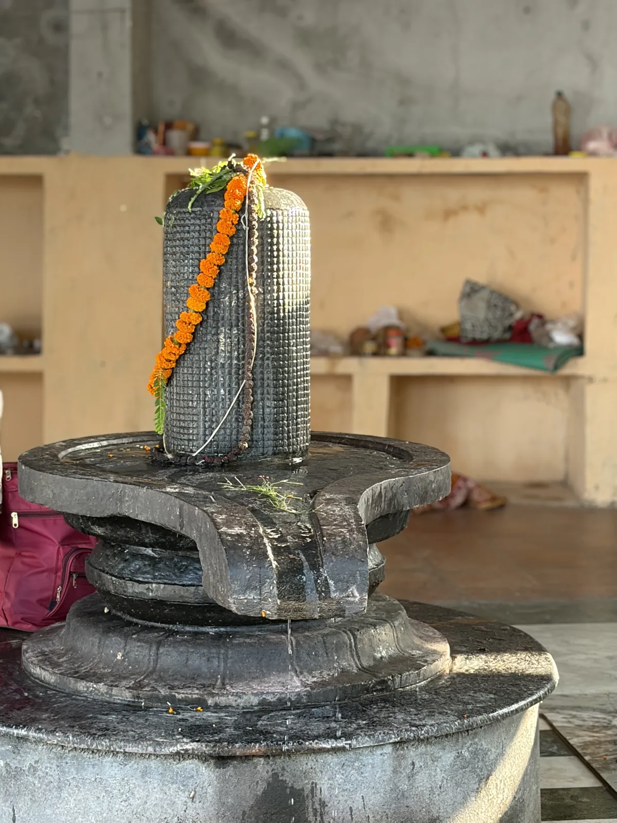 Shivling with marigold garland at a Haridwar temple